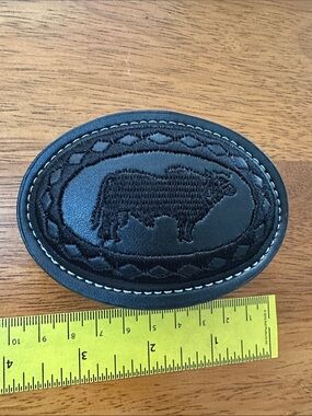 Black Oval Leather & Embroidered Belt Buckle with Bull Motif.